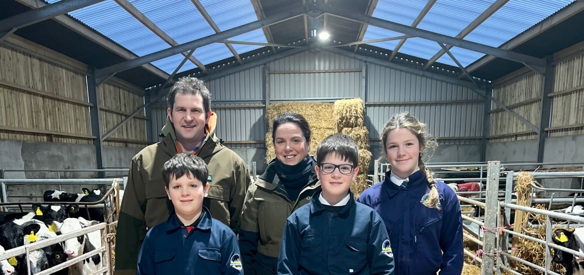 Iainfamily in the calf shed